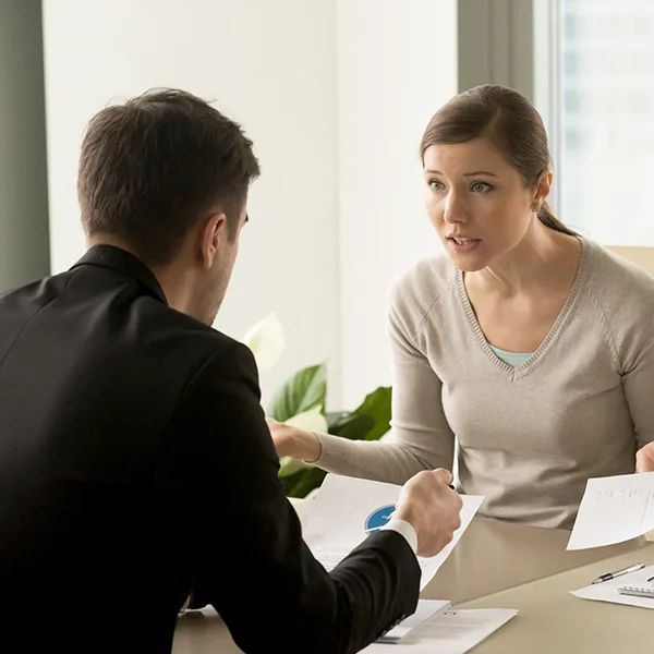 Client discussing loan documents with concern highlighting the risks of ignoring terms and conditions
